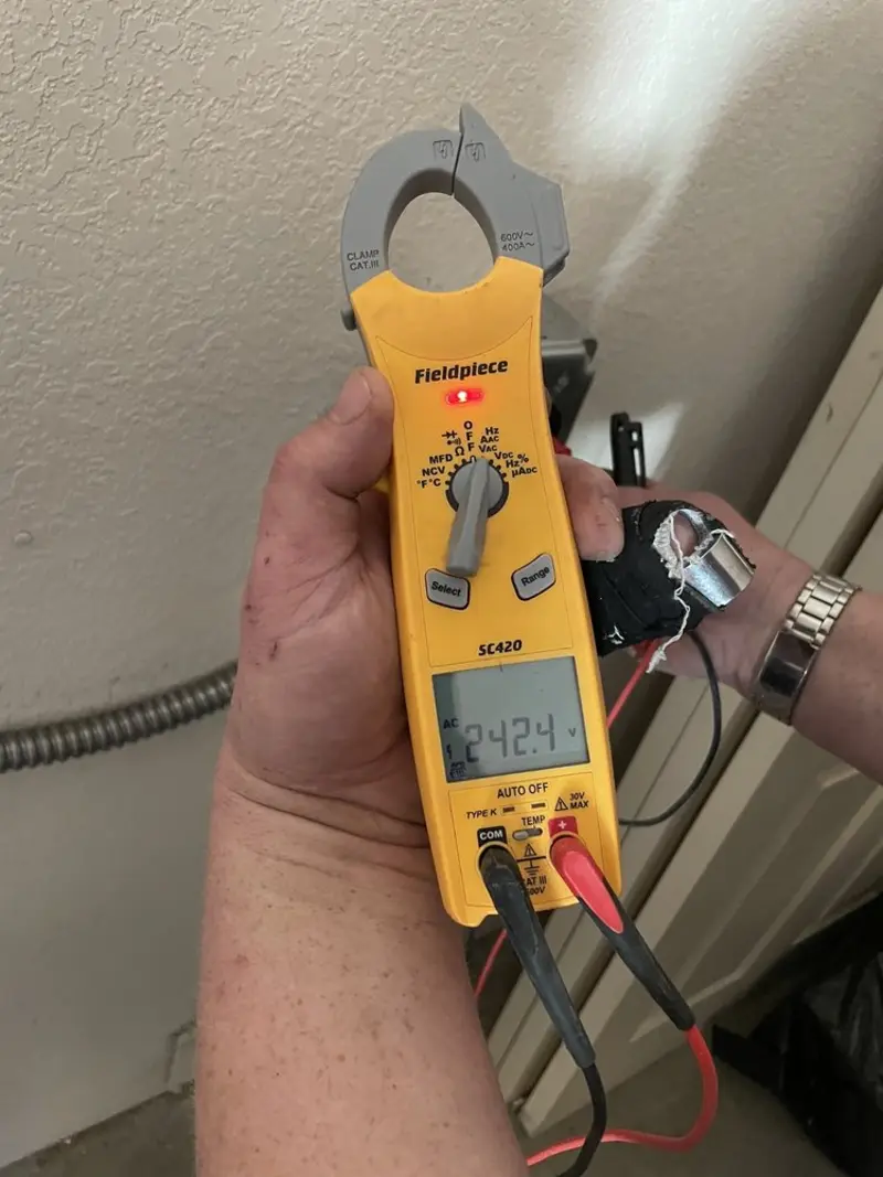Voltage testing with clamp meter during Aluminum Wiring Replacement in Oskaloosa
